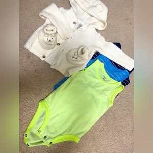 9- month toddler sweater with booties and 3 onesies.